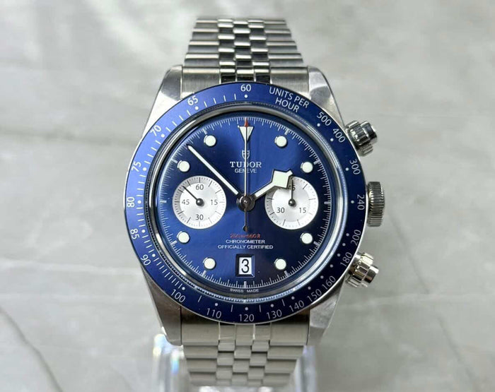 Tudor Black Bay Chronograph Blue front view on a clear stand with blue dial, pale subdials and blue tachymeter bezel.