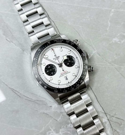 Tudor Black Bay Chronograph Panda lying flat with white dial, black subdials and black tachymeter bezel.