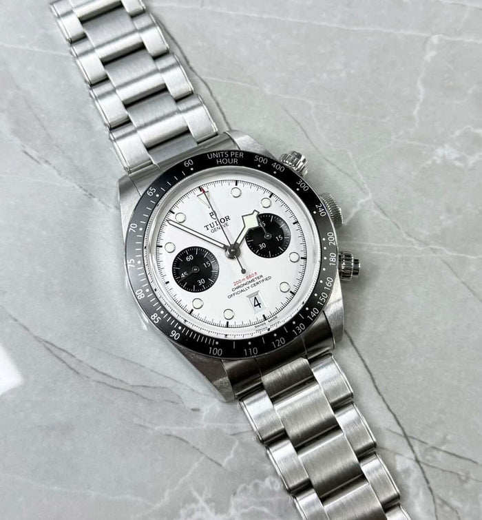 Tudor Black Bay Chronograph Panda lying flat with white dial, black subdials and black tachymeter bezel.