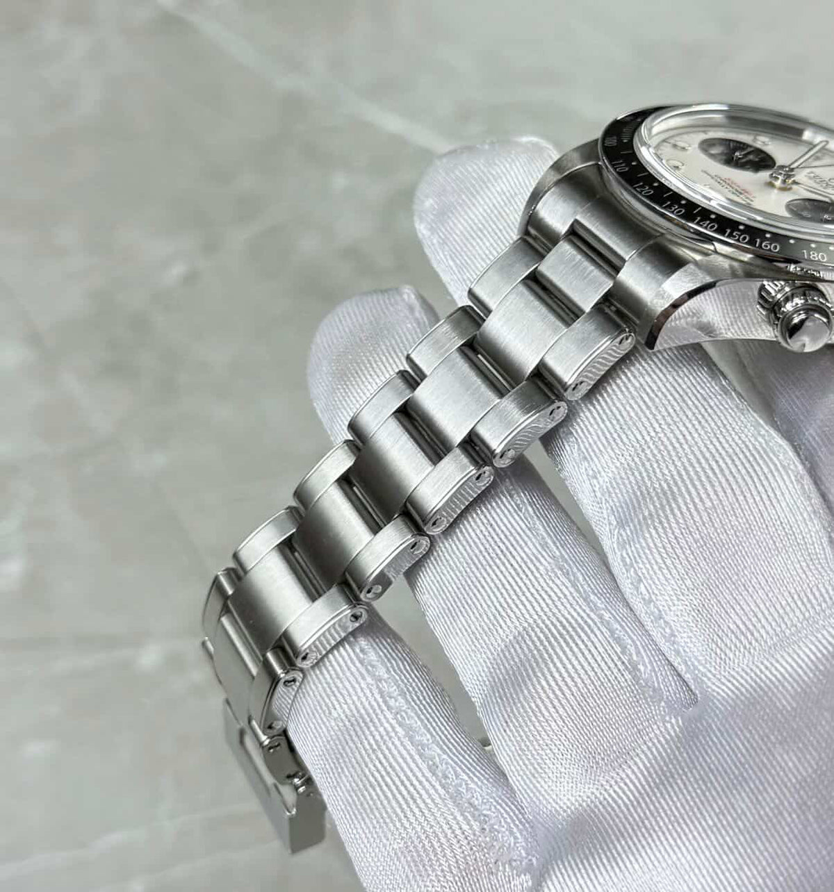 Tudor Black Bay Chronograph Panda angled bracelet view showing the crown and chronograph pushers.