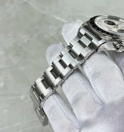 Tudor Black Bay Chronograph Panda angled bracelet view showing the crown and chronograph pushers.