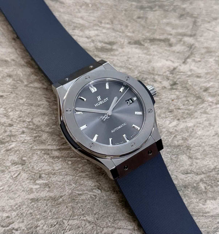 Hublot Classic Fusion lying flat with grey dial, date window and dark strap.