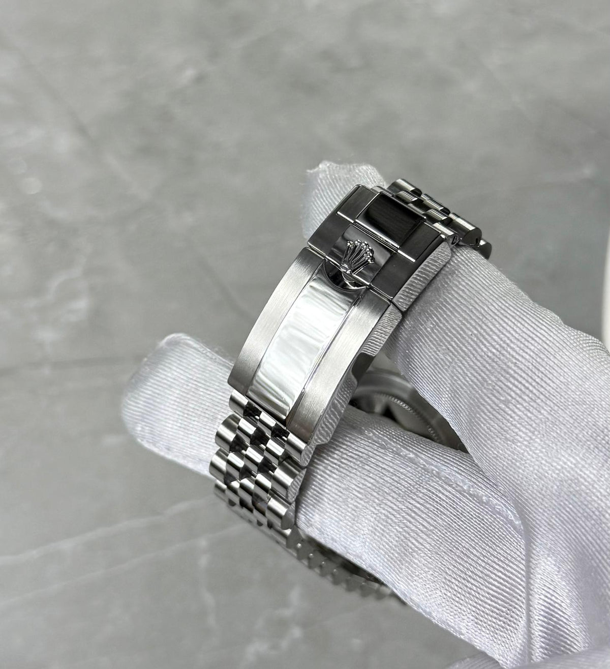 Rolex GMT-Master II Pepsi close-up of the crown-logo folding clasp and five-link bracelet.