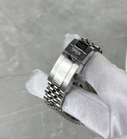 Rolex GMT-Master II Pepsi close-up of the crown-logo folding clasp and five-link bracelet.